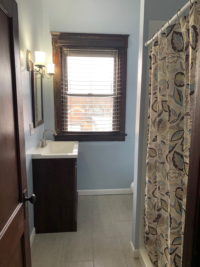 Renovated bathroom & shower. Includes wifi ceiling light - 1518 7th Ave Apartment Unit 1518 A