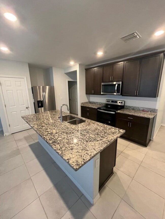 Photo - "Charming 3-Bed Townhouse with 2.5 Baths in St. Cloud's Serene Burrowing Owl Loop!"