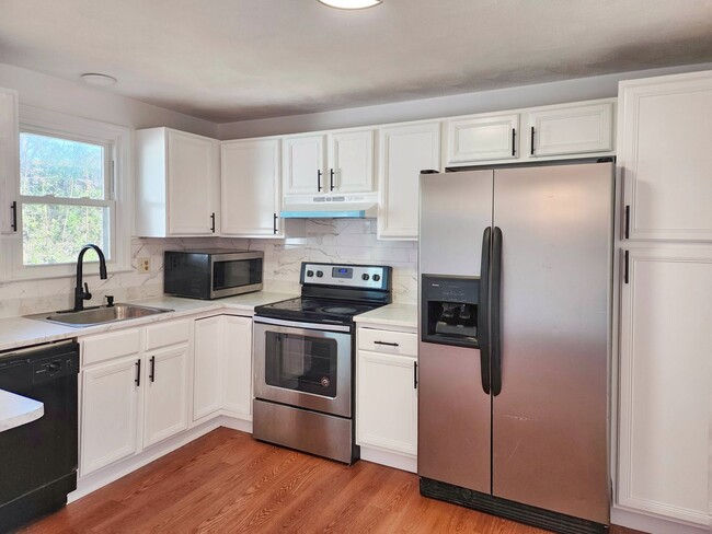 Photo - Beautifully remodeled townhouse with garage.