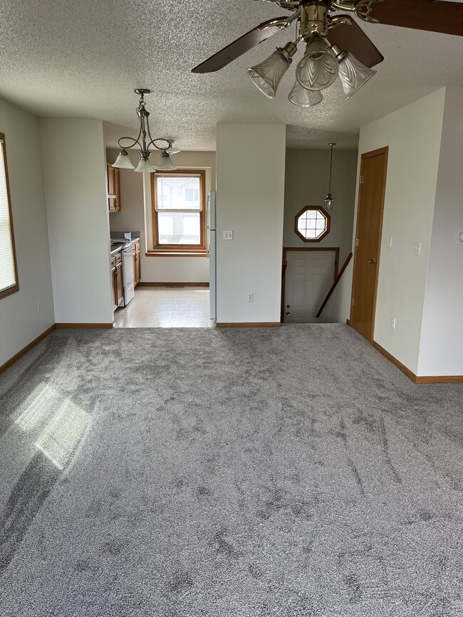 Living room facing dining area and kitchen - 2115 14th St Townhome