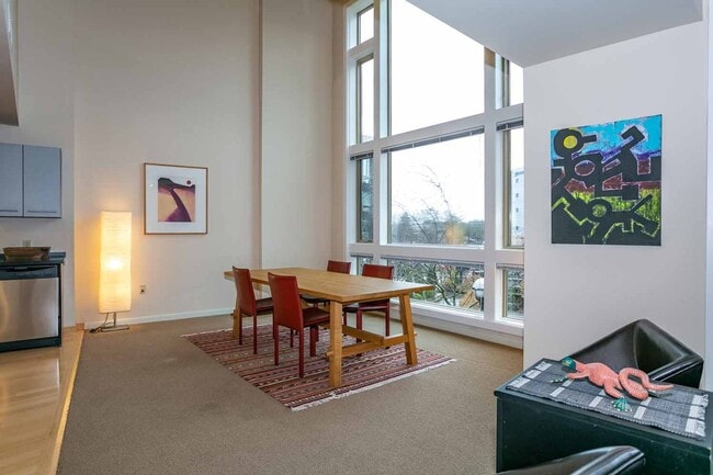 Photo - Gorgeous loft-style 2 floor condo with secured parking, A/C and rent includes most utilities! Unit 221