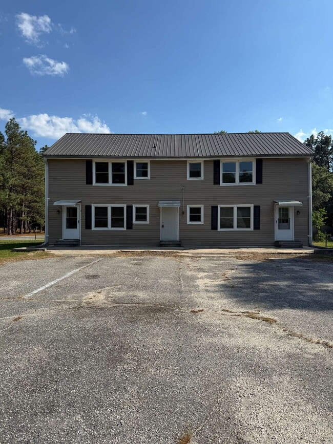 Building Photo - "Charming 1-Bedroom Condo Retreat in Pinebluff - Cozy 600 sq ft Haven!"