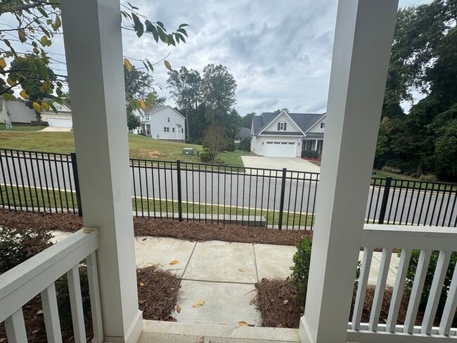 Photo - Cover front porch, two bedroom 2 1/2 bath townhome