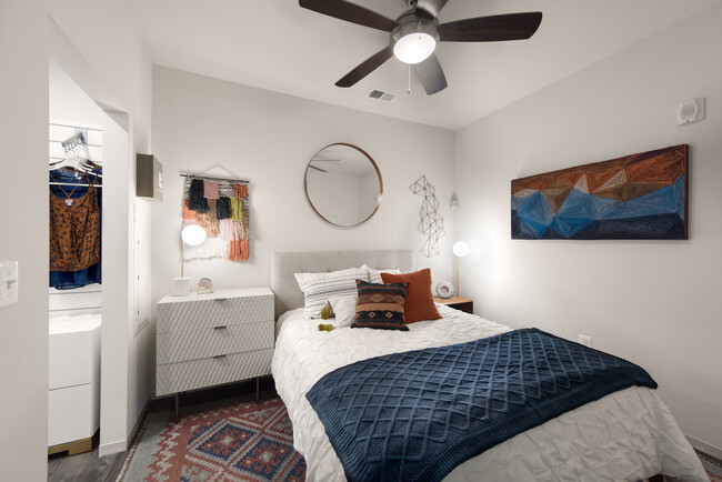 Bedroom with ceiling fan and hard surface flooring