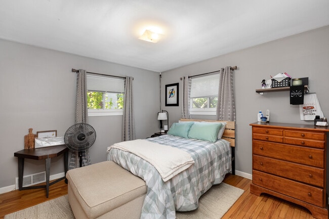 1st Spacious Bedroom with Previous Tenant's Furnishings (Queen Bed Set & Still Room to Move Around)