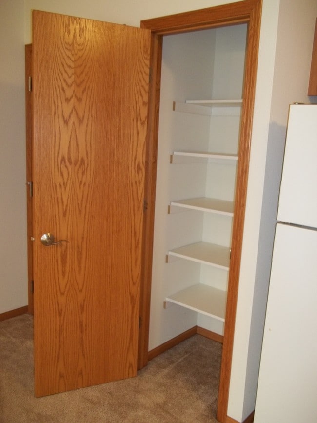 Kitchen pantry with shelving.