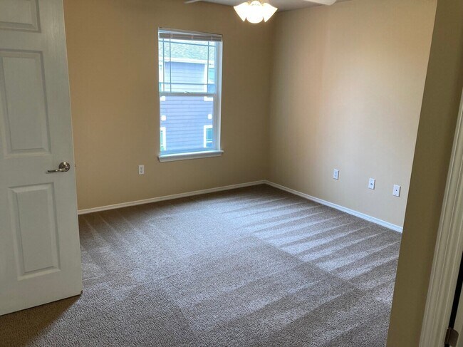 Step into the spacious allure of Bee Creek, featuring a cozy bedroom flooded with natural light and modern finishes. Ideal for relaxation and comfort, this inviting space awaits your personal touch. Schedule your tour today!