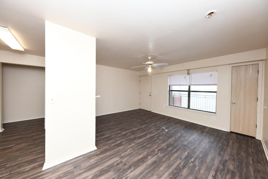 Spacious living room with hardwood-style flooring
