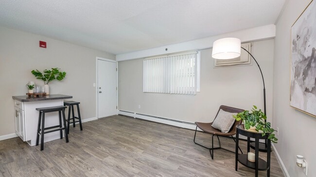 Your spacious living room features large windows allowing natural sunlight to shine through.