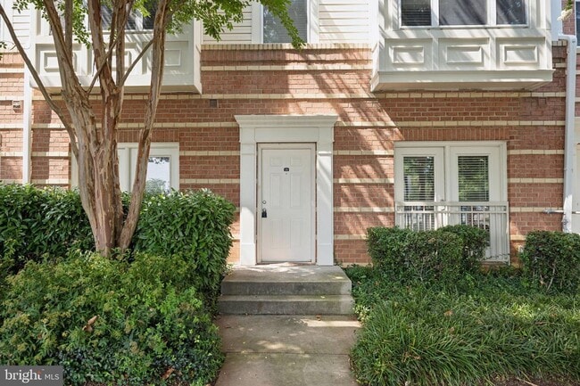 Building Photo - This townhouse style condo is located across the street from the Vienna Metro Station (Orange Line).