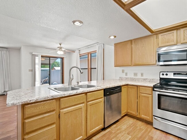 Photo - Spacious 2BR Rental with Open Floor Plan & Low-Maintenance yard