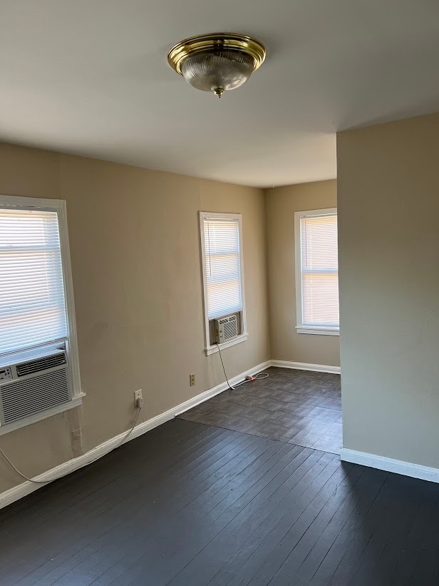 Living room, partial view. Wood floor and linoleum in the kitchen. - 1162 W 24th St Unit 1162 W 24