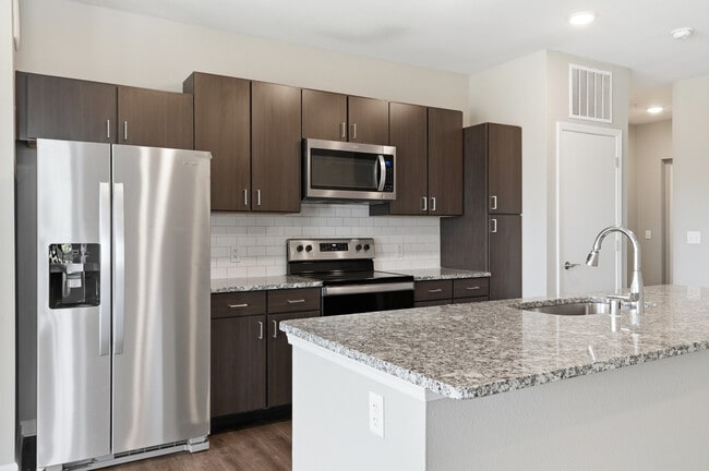 Cook, dine, and gather in a stylish kitchen space. - The Haven