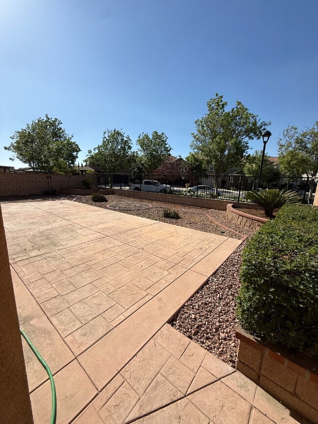 Photo - New flooring & paint!  Large backyard - landscaped and ready for garden!   Community pool, fitnes...