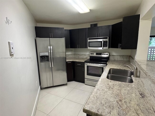 Building Photo - 10245 NW 9th St Cir Unit 114-9