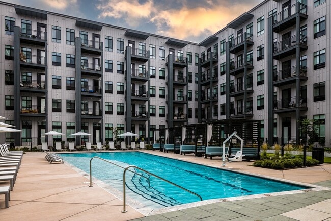 Wellsmith eastern courtyard with pool, putting green, reservable cabanas and an outdoor entertainment bar