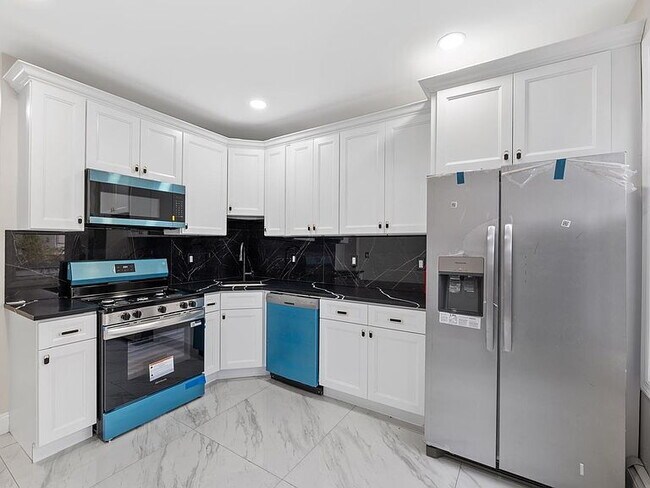 Photo - 3-Bedroom Gem with Modern Comfort in Bayonne – 1300 Sq. Ft. of Urban Living!"