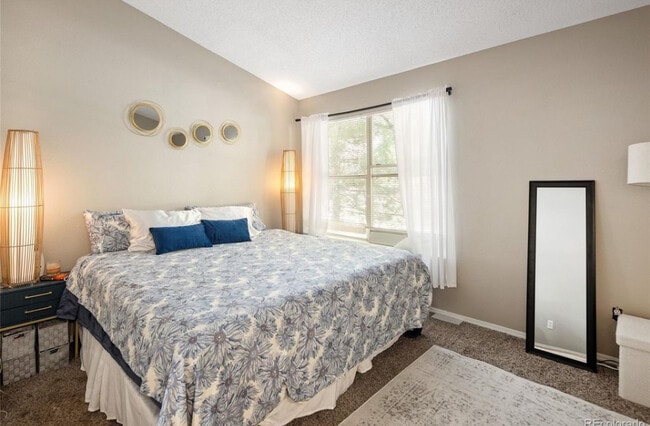 Bedroom 1 with bathroom - 10587 W Maplewood Dr