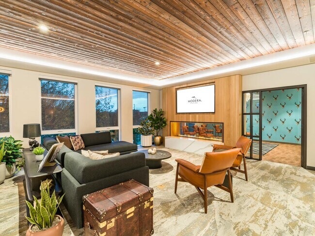 Gather with friends in the game room featuring a wet bar, shuffleboard, and board games.