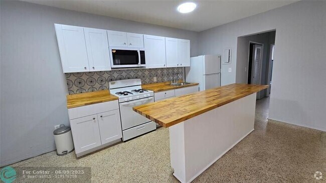 Building Photo - 7725 Harding Ave Unit 3 Rental