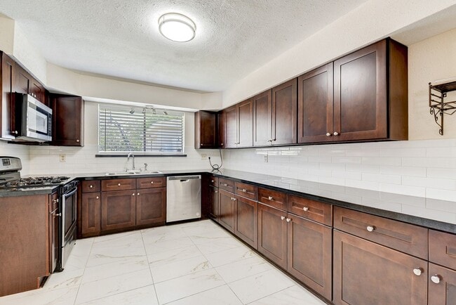 Building Photo - Stylish Upgrades, Open Layout, and Room to... Rental