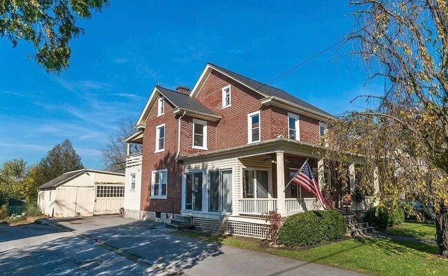 Photo - Spacious 4-Bedroom Home with Sunroom, Garage & Private Driveway!