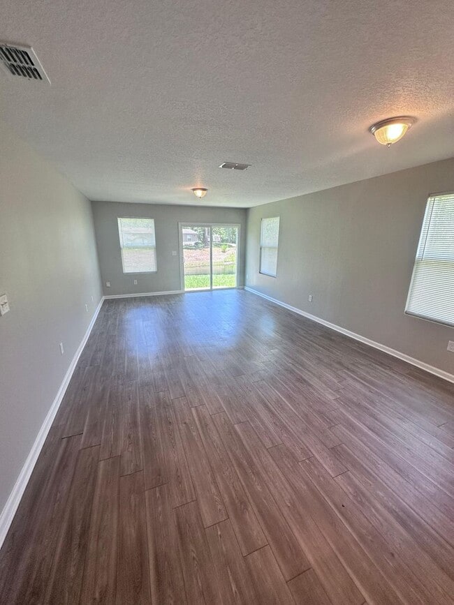 Photo - Gorgeous 4-Bedroom Home with Granite Counters & 2-Car Garage