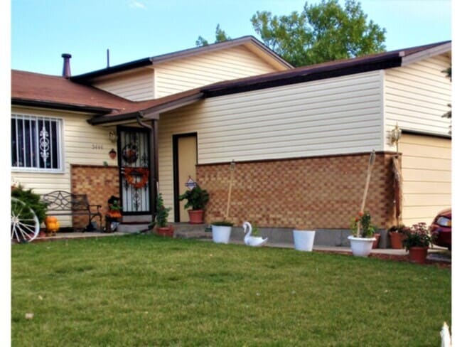 Building Photo - Four bedroom home with an attached two car...