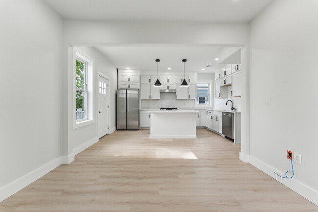 Open floor living Room and Kitchen with an island - 47 Brackett St Condo Unit 2