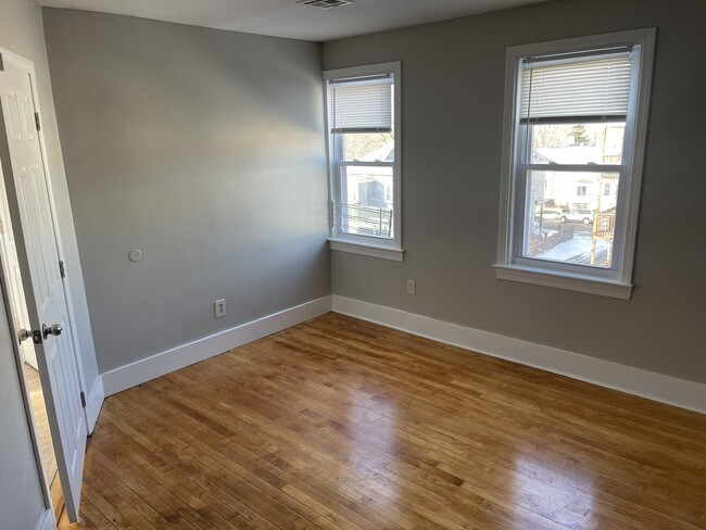 1 of 3 bedrooms all with hardwood floors - 348 Crescent St Apartments Unit 348 Crescent St