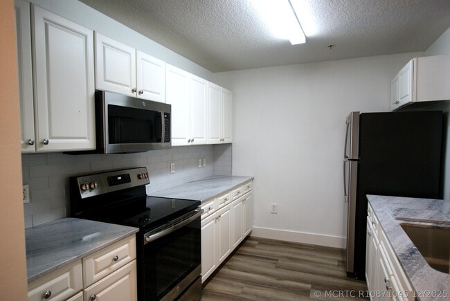 Building Photo - 1203 Town Center Dr Unit 209