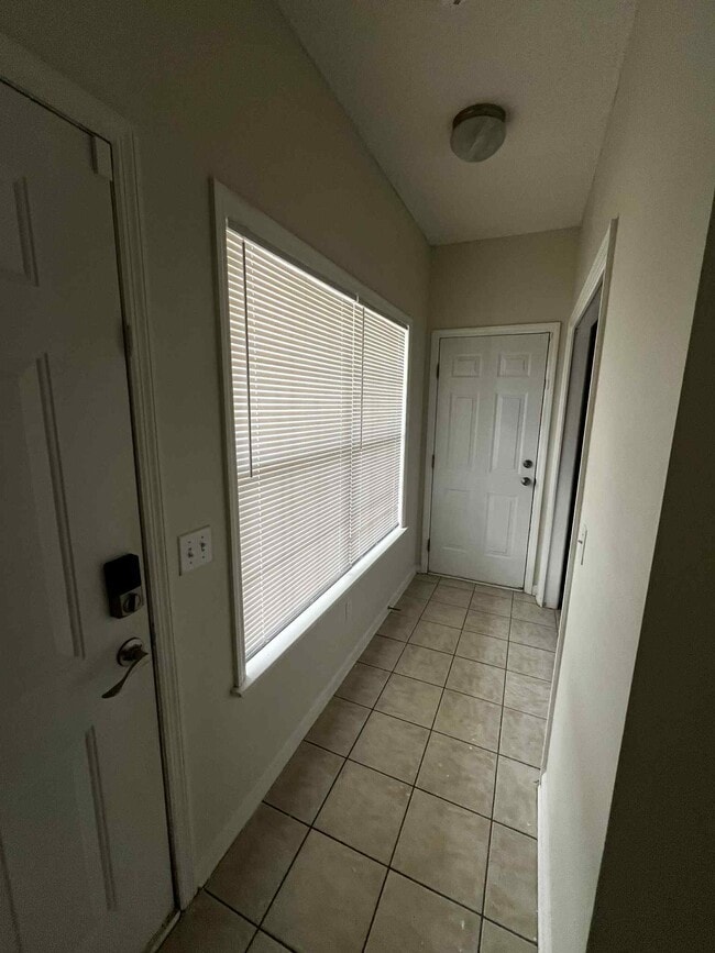 Hallway to laundry room and garage