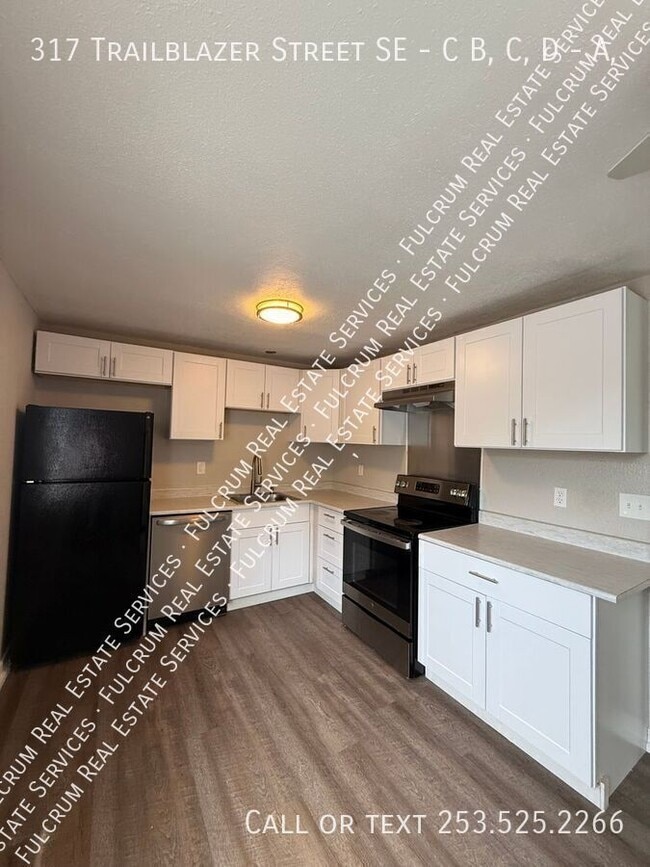 Photo - 317 Trailblazer St SE Unidad A,