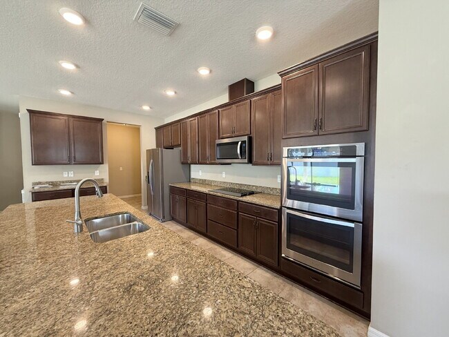 Photo - Spacious 4-Bedroom Retreat with additional office/den in the Heart of Trinity!