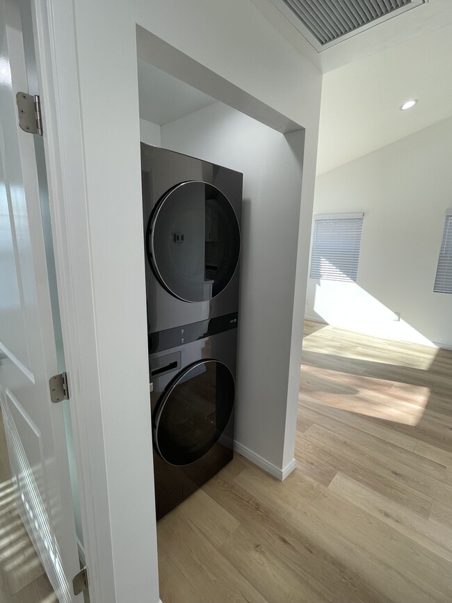 in-unit washer and dryer with space-saving stacked design - 327 Aliso St