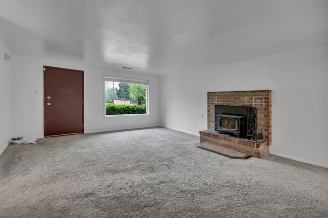 Photo - Cozy 4-Bedroom Home with Wood Stove & Large Backyard in Mountlake Terrace