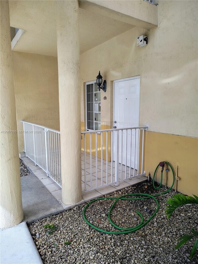 Building Photo - 6990 NW 179th St Unit 101-2