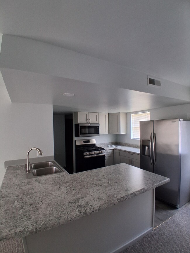 Kitchen - Candlelight Apartments & Condos