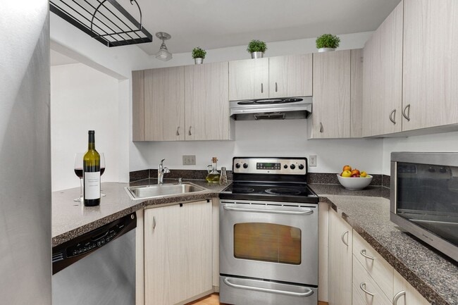 Photo - 2 level condo, 3 decks, Stainless Appliances, 2 parking spots, Water, sewer, garbage included!