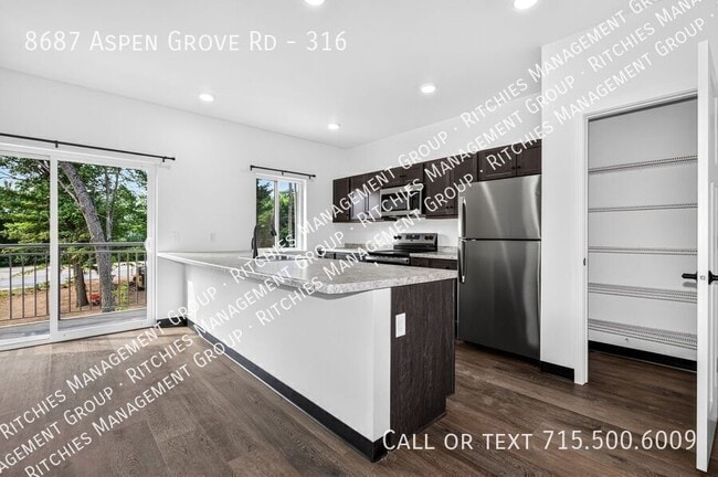 Building Photo - 8687 Aspen Ln Unit 316