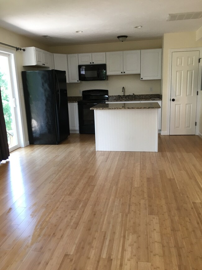 open living area to kitchen - 12 Cranberry Rd Unit 1