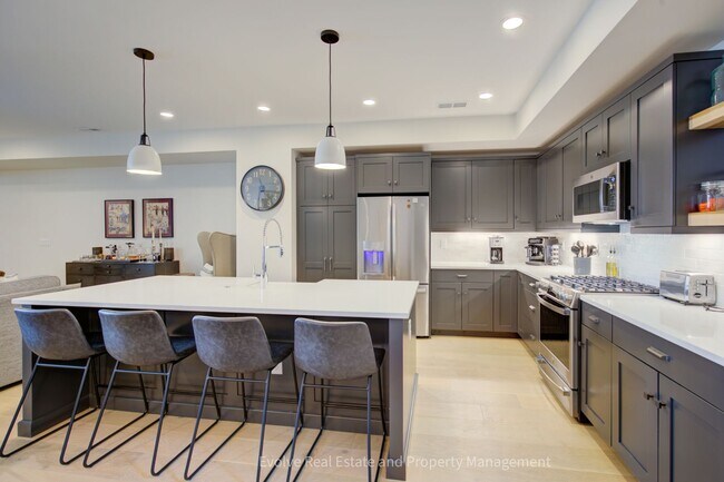 Photo - Evolve Real Estate: Discover Your Ideal Townhome With 4 Beds/4 Baths and Two-Car Attached Garage ...