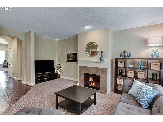 Photo - Bright and Open Floor Plan with Fireplace, Attached Garage & Vaulted Ceilings