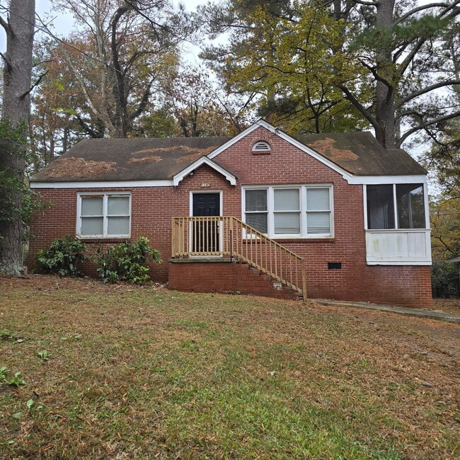 Building Photo - Full brick 3 bedroom, 1 and half bath home with screened in side porch, and an attic for extra st...