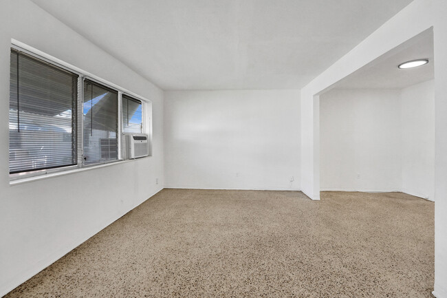 Living room and dining area - 710 82nd St Apartments