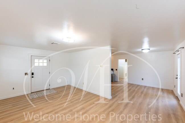 Photo - Comfortable 3-Bedroom Home with Fenced Yard and Attached Carport