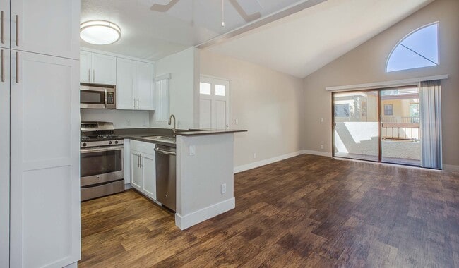 Spacious kitchens with wood flooring throughout