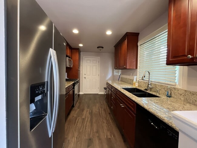 Photo - Charming Single-Level 3 Bedroom Home with Spacious Fenced Backyard, Landscaping Included & Great ...