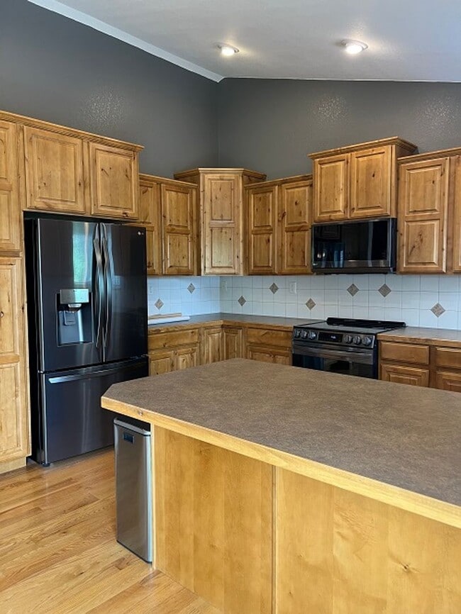 Photo - Spacious 5-Bedroom Home with Finished Basement and 3-Car Garage in Wellington