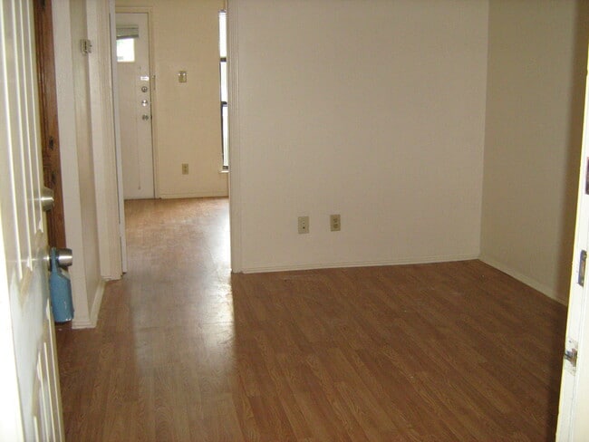 Living room, and entry to bedroom. - 4401 Speedway Unit #101